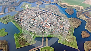 Aerial top view of Naarden city fortified walls in star shape and historic village in Holland, Netherlands