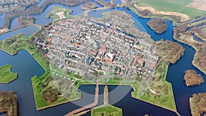 Aerial top view of Naarden city fortified walls in star shape and historic village in Holland, Netherlands photo