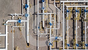 Aerial top view natural gas pipeline, gas industry, gas transport system, stop valves and appliances for gas pumping station.