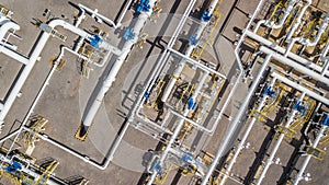 Aerial top view natural gas pipeline, gas industry, gas transport system, stop valves and appliances for gas pumping station.