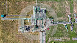 Aerial top view natural gas pipeline, gas industry, gas transport system, stop valves and appliances for gas pumping station