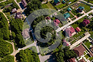 Aerial top view on new development neighborhood in Novosibirsk, Russia in morning summer with colorful leaves and roofs of houses