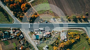 Aerial top view of the new road, road marking. Village, field