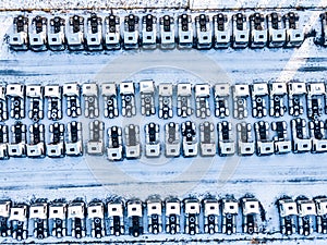 Aerial top view of new truck cars parking for sale stock lot row, dealer inventory import and export business commercial, Automobi