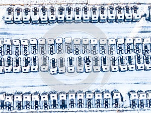 Aerial top view of new truck cars parking for sale stock lot row, dealer inventory import and export business commercial, Automobi