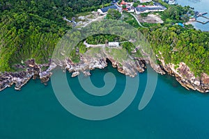Aerial top view of ocean waves, beach and rocky coastline and beautiful forest. Beautiful nature background. island background and