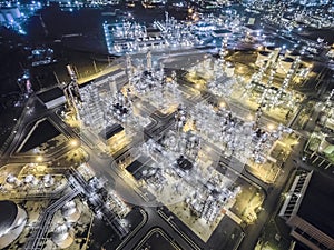 Aerial top view Oil refinery at night .