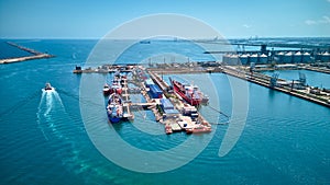 Aerial top view of oil tanker ships at the port, Oil terminal is industrial facility for storage of oil and petrochemical