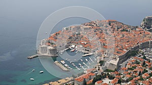 Aerial top view on the old city of Dubrovnik, from the observation deck on the mountain above the city. Film location