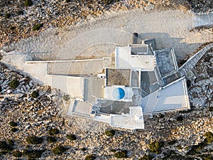 Aerial top view on Ortodox church Agios Symeon, Sifnos island Kamares,