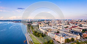 Aerial top view panorama city Perm and central embankment of Kama river Russia, sunset drone photo