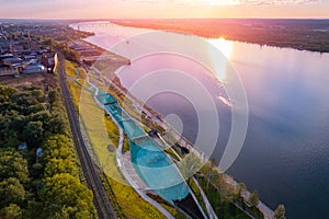 Aerial top view panorama city Perm and central embankment of Kama river Russia, sunset drone photo