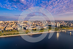 Aerial top view panorama city Perm and central embankment of Kama river Russia, sunset drone photo