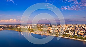 Aerial top view panorama city Perm and central embankment of Kama river Russia, sunset drone photo