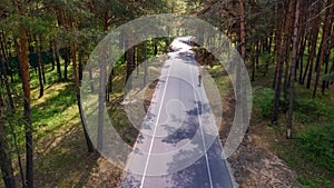 Aerial top view of park forest road with bike lanes, Truhaniv island, Kiev, Ukraine