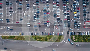 Aerial top view of parking lot with many cars from above, city transportation concept