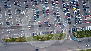 Aerial top view of parking lot with many cars from above, city transportation concept