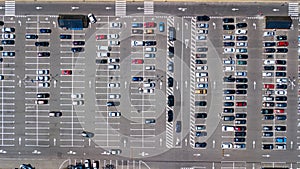 Aerial top view of parking lot with many cars from above, transportation concept