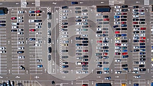 Aerial top view of parking lot with many cars from above, transportation concept