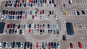 Aerial top view of parking lot with many cars from above, transportation concept