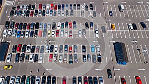 Aerial top view of parking lot with many cars from above, transportation concept