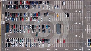 Aerial top view of parking lot with many cars from above, transportation concept