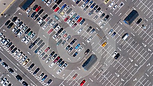 Aerial top view of parking lot with many cars from above, transportation concept