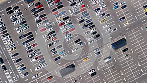 Aerial top view of parking lot with many cars from above, transportation concept