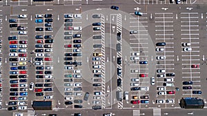 Aerial top view of parking lot with many cars from above, transportation concept photo