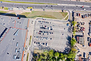 Aerial top view of parking lot near supermarket