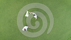 Aerial top view of people playing golf in luxury tropical resort Punta Cana, Dominican Republic