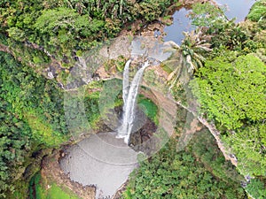 Aerial top view perspective of Chamarel Waterfall in the tropical island jungle of Mauritius.