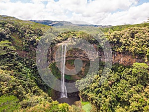 Aerial top view perspective of Chamarel Waterfall in the tropical island jungle of Mauritius.