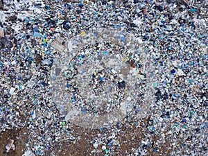 Aerial top view photo of large garbage pile at solid waste landfill
