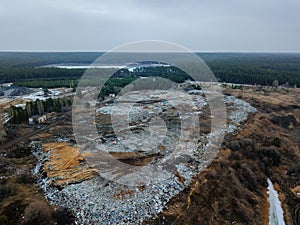 Aerial top view photo of large garbage pile at solid waste landfill