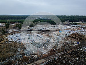 Aerial top view photo of large garbage pile at solid waste landfill