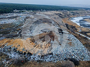 Aerial top view photo of large garbage pile at solid waste landfill