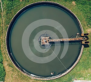 Aerial top view of poll in wastewater treatment plant, filtration of dirty or sewage water. Circle