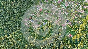 Aerial top view of residential area summer houses in forest from above, countryside real estate and dacha village in Ukraine photo