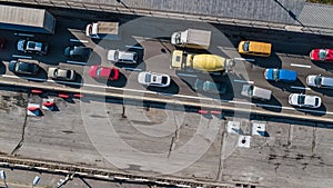 Aerial top view of road automobile traffic jam of many cars from above, block and road repair, city transportation