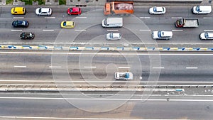 Aerial top view of road automobile traffic of many cars on highway from above, city transportation