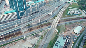 Aerial top view of road junction in Moscow from above, automobile traffic and jam of many cars, transportation concept