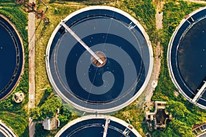 Aerial top view of round polls in wastewater treatment plant, filtration of dirty or sewage water