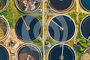 Aerial top view of round polls in wastewater treatment plant, filtration of dirty or sewage water