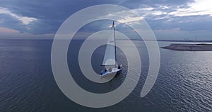 Aerial top view of a sailing yacht regatta. Flying over boats. Colored sails