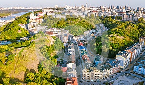 Aerial top view of Saint Andrew`s church and Andreevska street from above, cityscape of Podol district, city of Kiev