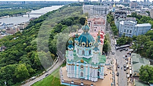 Aerial top view of Saint Andrew`s church and Andreevska street from above, cityscape of Kiev Kyiv, Ukrai photo