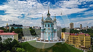 Aerial top view of Saint Andrew`s church and Andreevska street from above, Podol, city of Kiev Kyiv, Ukraine