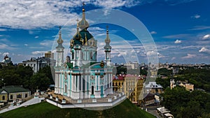 Aerial top view of Saint Andrew`s church and Andreevska street from above, Podol, city of Kiev Kyiv, Ukraine