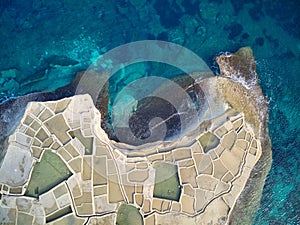Aerial top view of Salt evaporation ponds on the coast of the island of Gozo also called Salinas